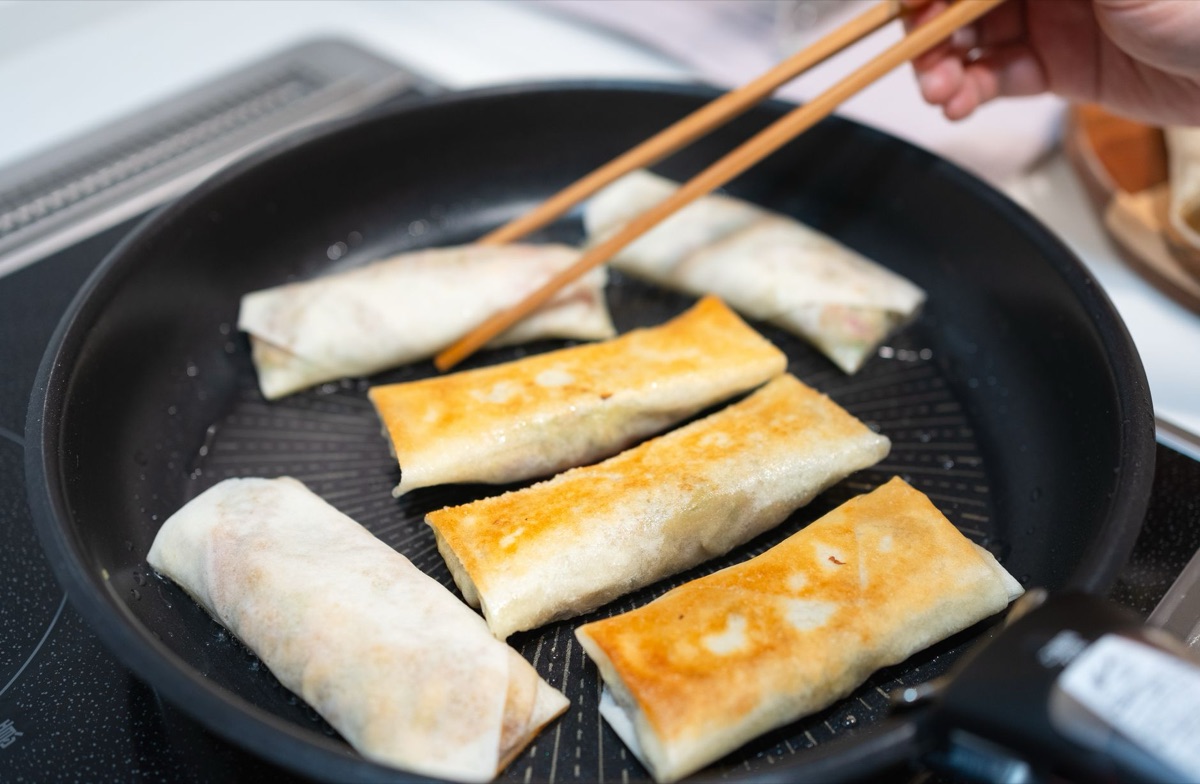 Peeling non-stick pan on counter